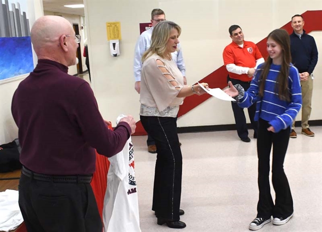 Student receiving award