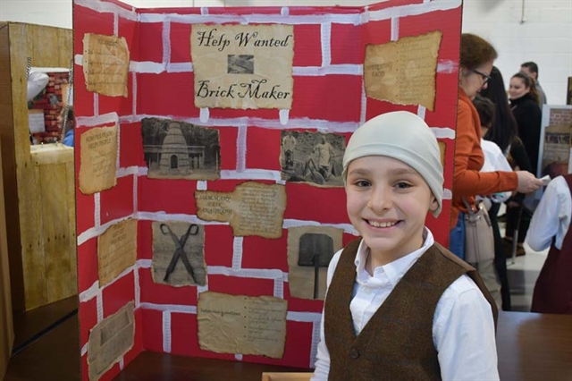 student dressed up in colonial times smiling