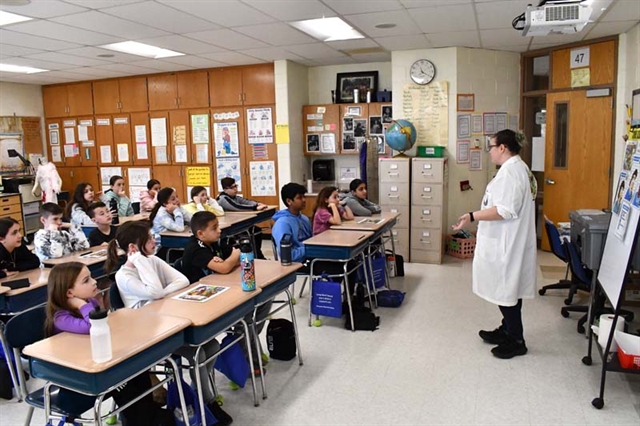 students conducting science experiment in class