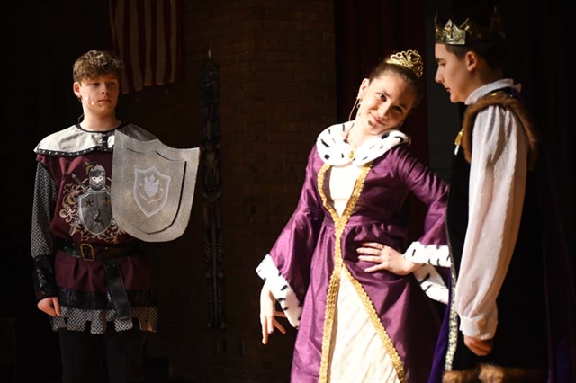 Students performing on stage