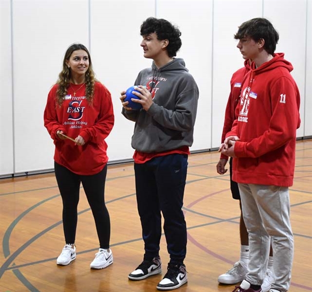 High School students talking with younger students