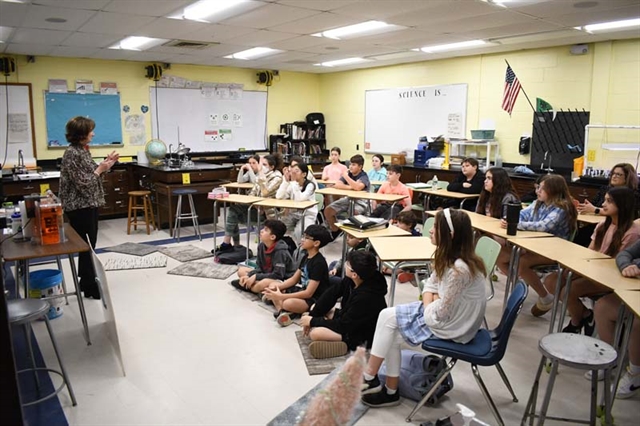 students listening to presenter