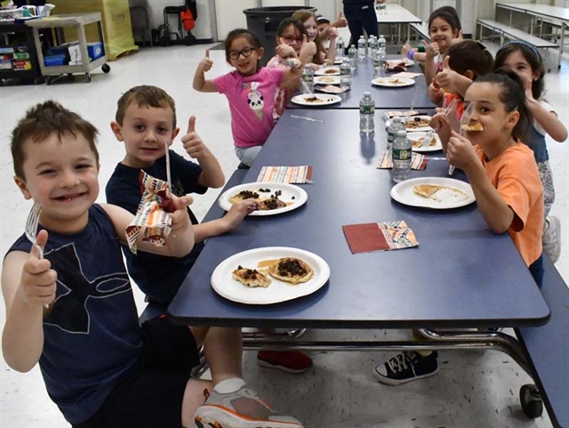 students eating pancakes