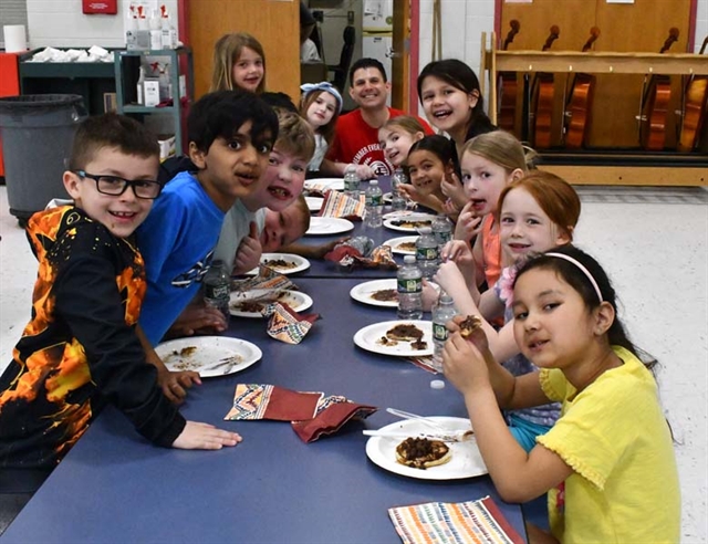 students eating pancakes