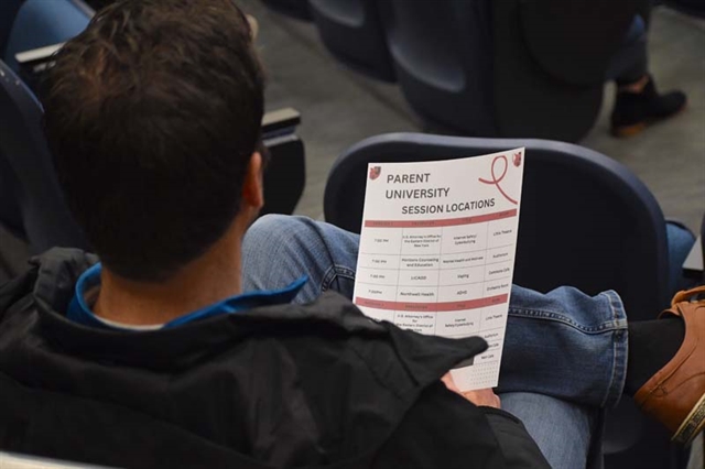 Community member looking at flyer