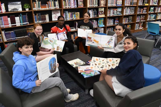 Students holding books