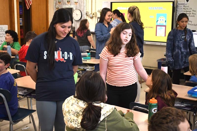 HSW students teaching different languages to elementary students