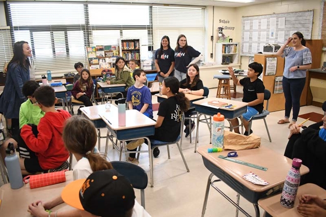 HSW students teaching different languages to elementary students