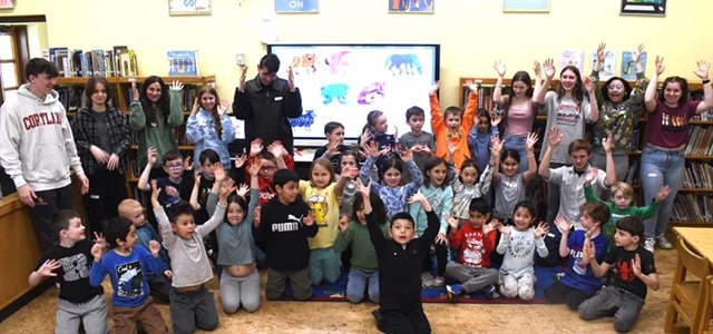 Students performing sign language