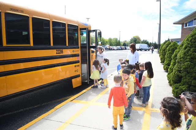 students boarding the bus