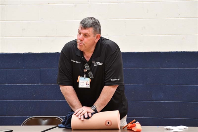 instructor doing chest compressions