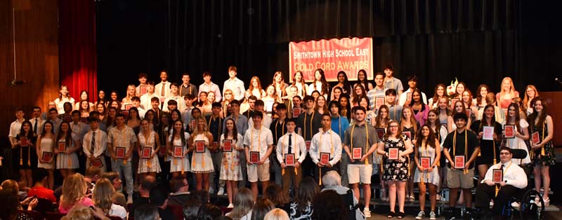 students on stage for picture