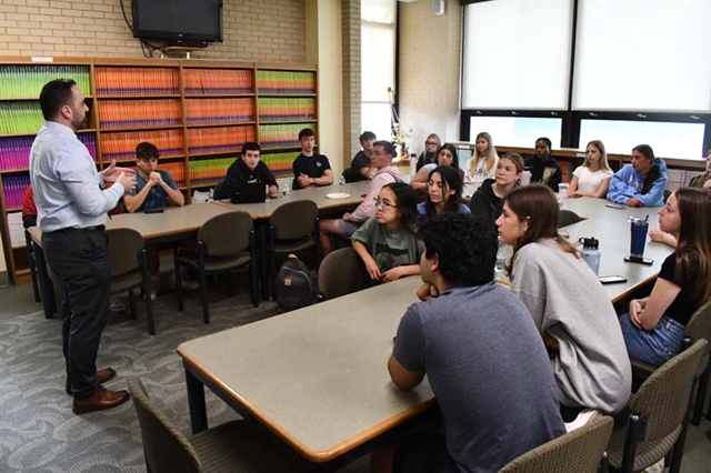 teacher talking to students