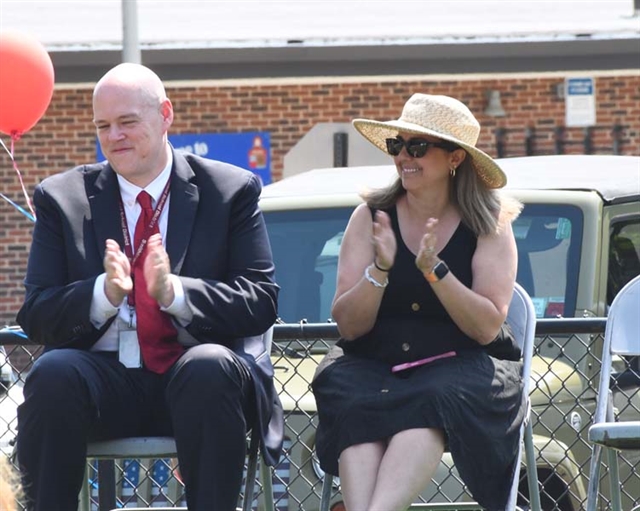 Administrators looking on