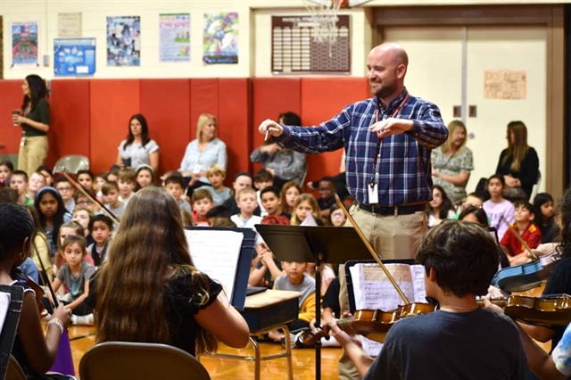 Music teacher conducting