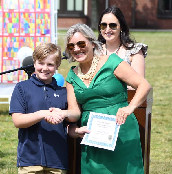 Principal with student smiling