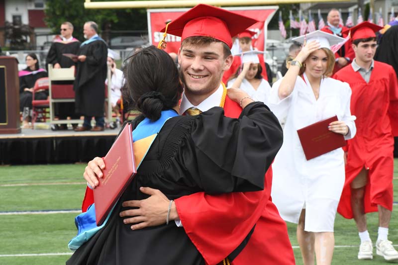 students hugging