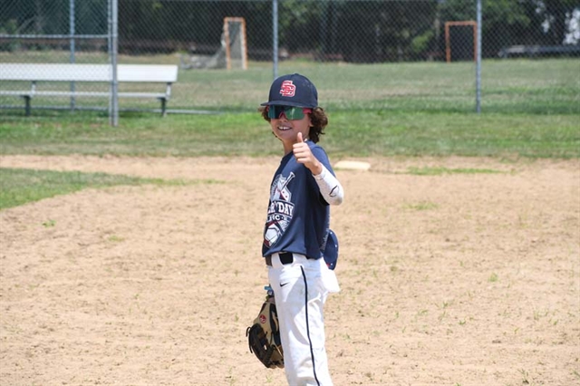 baseball player giving thumbs up