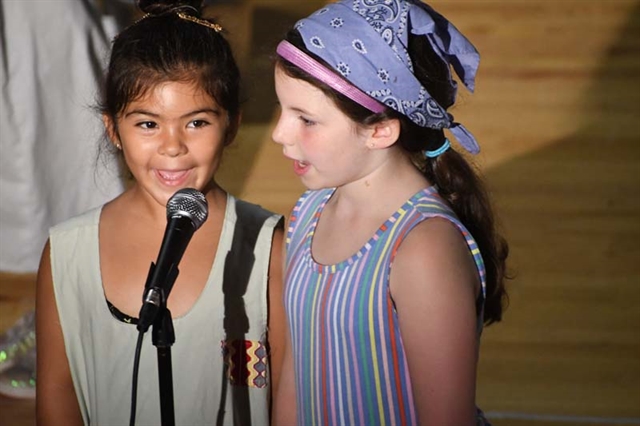 students on stage performing