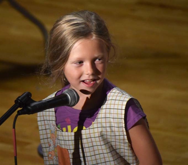 student on stage performing