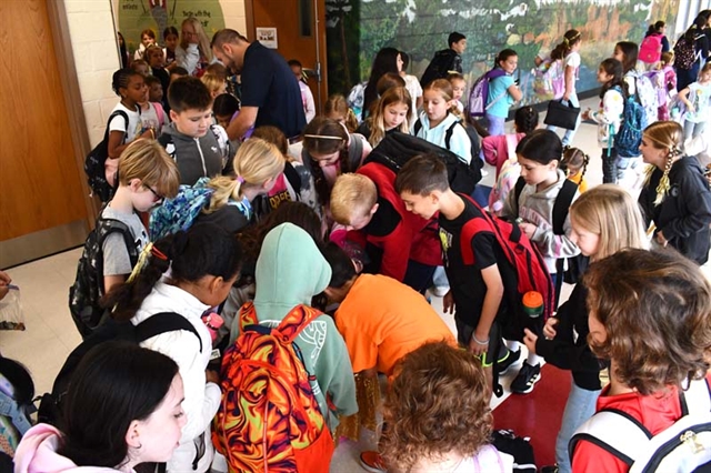 students donating coins