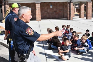 firefighter teaching students