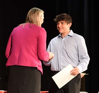 student accepting award