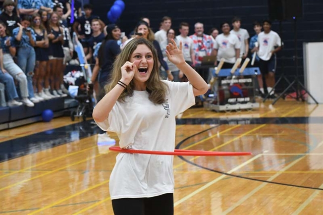 student doing hula hoop