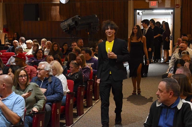 students walking down aisle