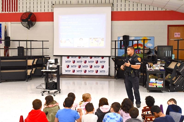 Officer Allison speaking to students