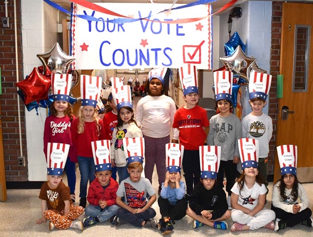 First grade students smiling for picture