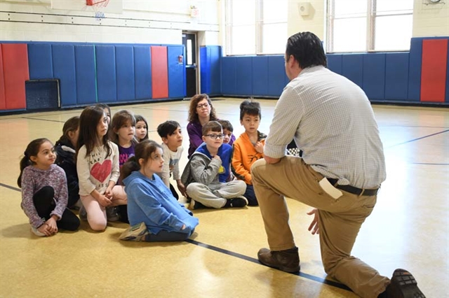 students listening to presenter