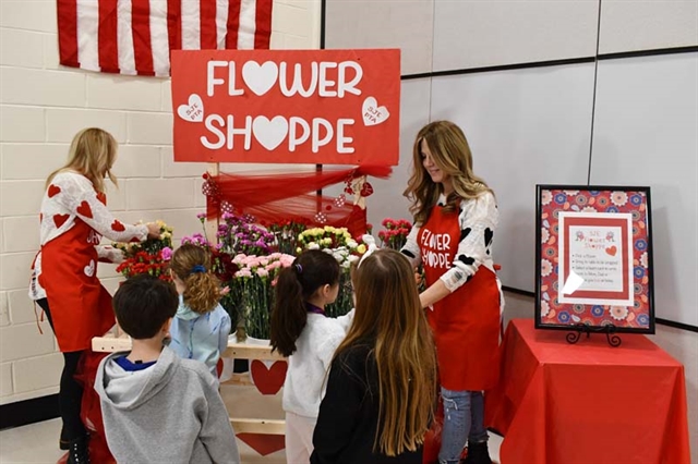 pta handing out flowers