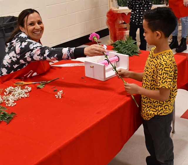 Pat member handing out a flower