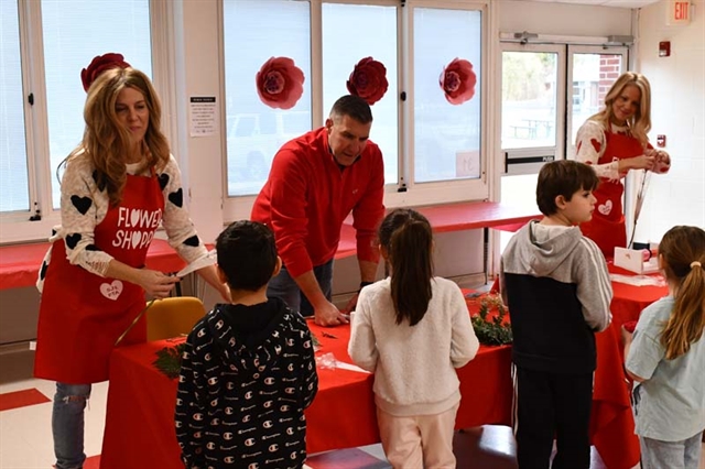 pta handing out flowers