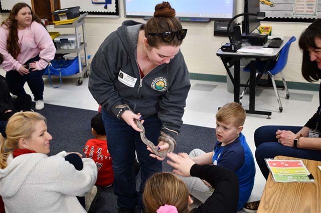 students with a snake