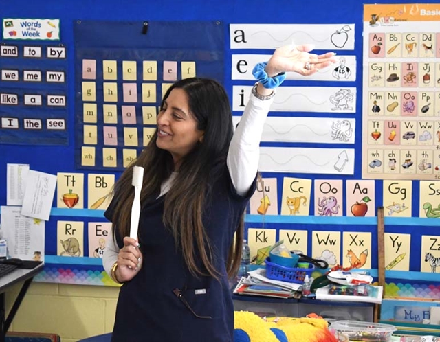 Dentist speaking with students