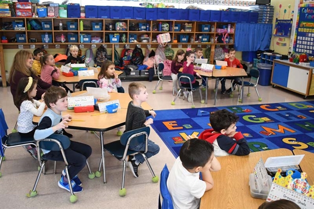Dentist speaking with students