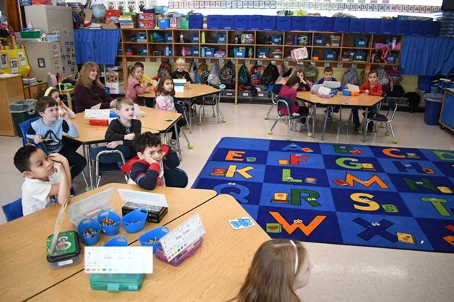 Dentist speaking with students
