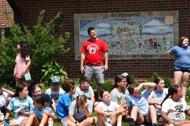 principal watching egg drop