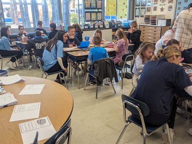 students writing thank you letters