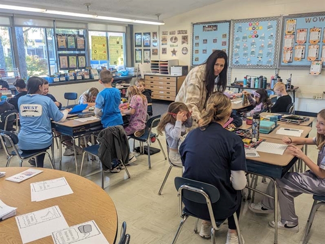 students writing thank you letters