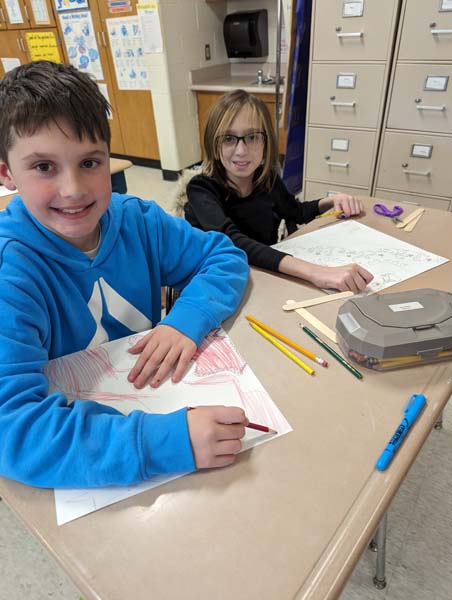 students making paper dragon