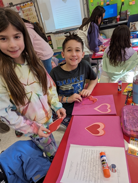 Students making valentines cards