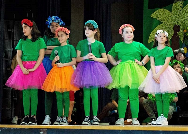 students on stage for performance