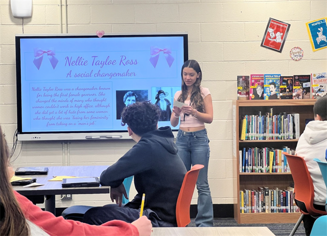 students presenting in front of the class