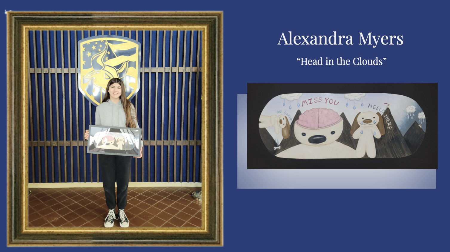 Student holding artwork