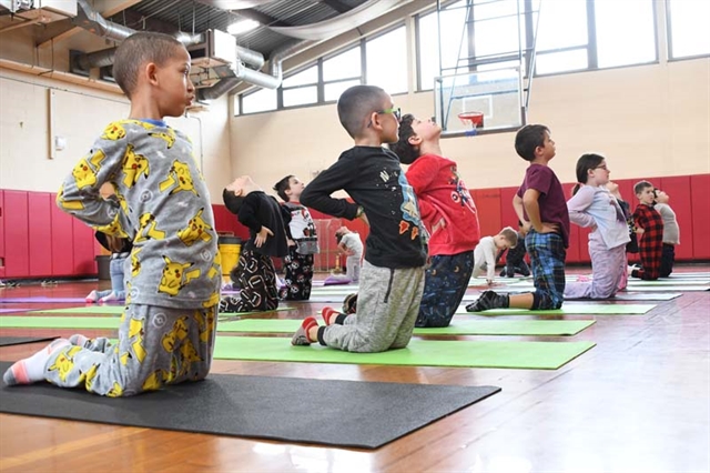 students practicing yoga