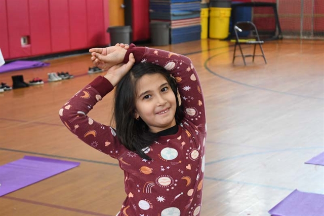 students practicing yoga