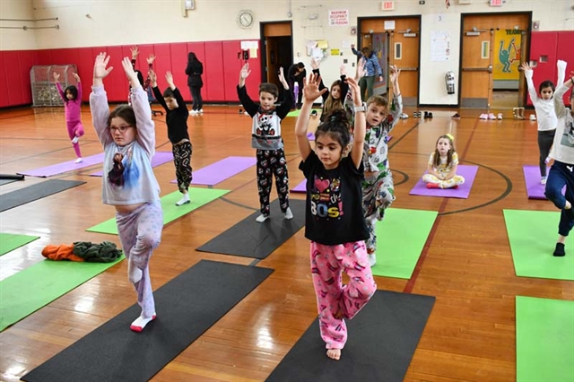 students practicing yoga